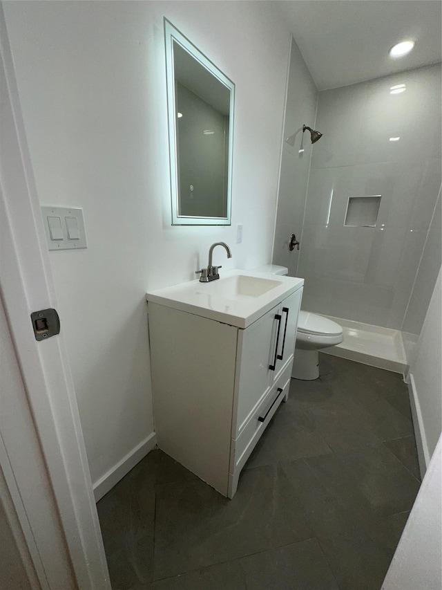 84 Windsor, Hempstead, NY 11550 - full bath featuring toilet, vanity, tiled shower, and baseboards