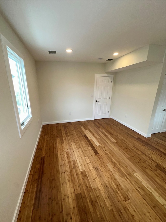 84 Windsor, Hempstead, NY 11550 - spare room featuring dark wood-style floors, baseboards, and recessed lighting