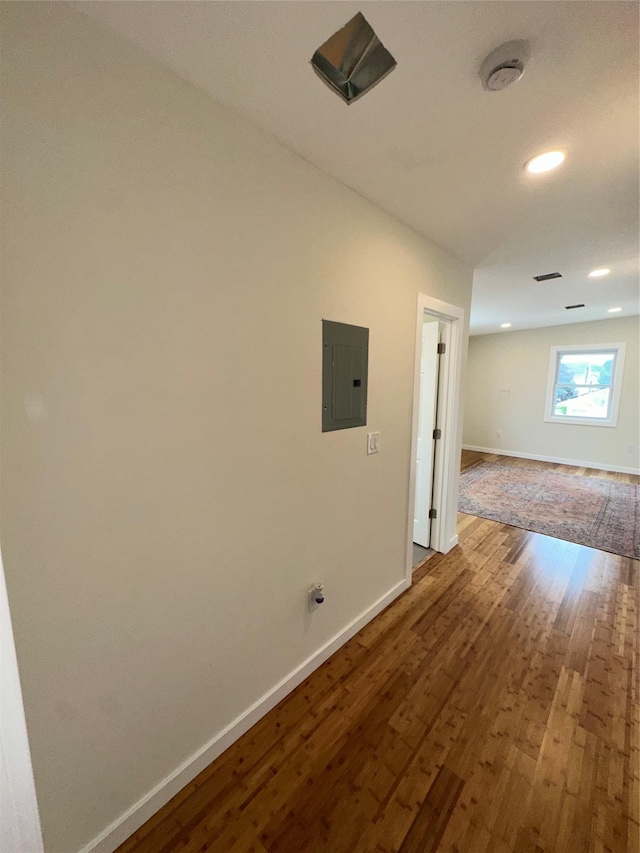 84 Windsor, Hempstead, NY 11550 - empty room with electric panel, baseboards, wood finished floors, and recessed lighting
