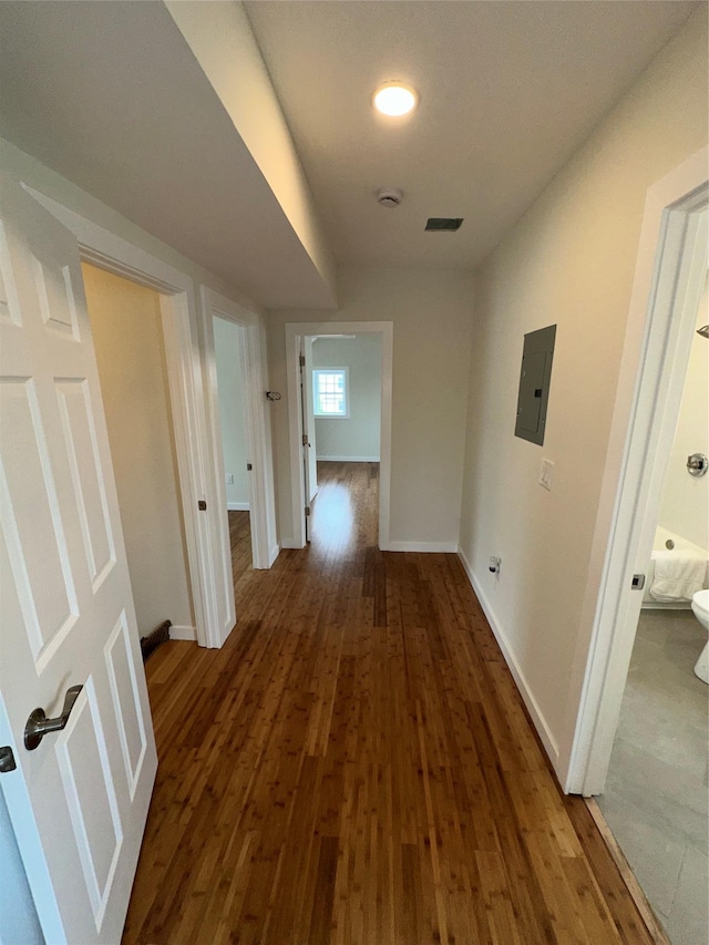 84 Windsor, Hempstead, NY 11550 - hallway featuring electric panel, wood finished floors, and baseboards