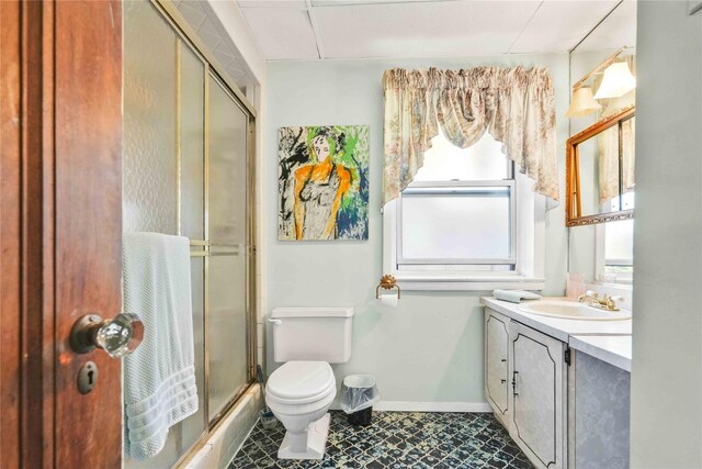 95 Malba Dr Unit 1, Malba, NY 11357 - full bathroom with healthy amount of natural light, vanity, toilet, and baseboards