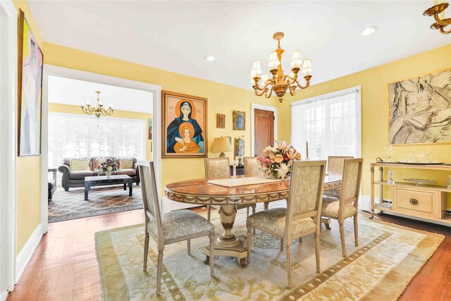 95 Malba Dr Unit 1, Malba, NY 11357 - dining room featuring a chandelier, healthy amount of natural light, wood finished floors, recessed lighting, and baseboards