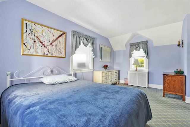 95 Malba Dr Unit 1, Malba, NY 11357 - carpeted bedroom featuring radiator, vaulted ceiling, and baseboards