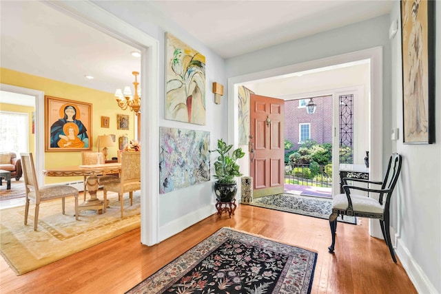 95 Malba Dr Unit 1, Malba, NY 11357 - entryway featuring a chandelier, wood finished floors, baseboards, and recessed lighting
