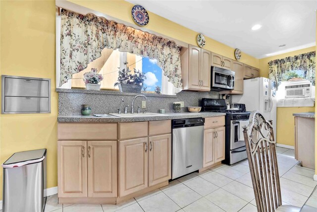 95 Malba Dr Unit 1, Malba, NY 11357 - kitchen featuring stainless steel appliances, a sink, light brown cabinets, decorative backsplash, and recessed lighting