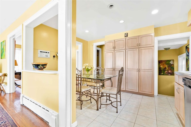 95 Malba Dr Unit 1, Malba, NY 11357 - dining room with a baseboard radiator, light tile patterned flooring, and baseboards