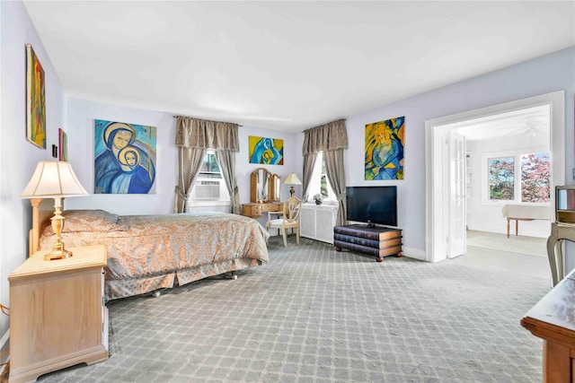 95 Malba Dr Unit 1, Malba, NY 11357 - carpeted bedroom with baseboards and cooling unit