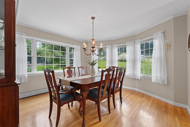 1 Bray Farm Ln, Wappingers Falls, NY 12590 - dining room with plenty of natural light, baseboard heating, a chandelier, light wood finished floors, and ornamental molding