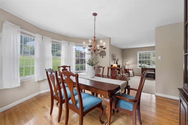 1 Bray Farm Ln, Wappingers Falls, NY 12590 - dining room with a chandelier, light wood-style flooring, and baseboards