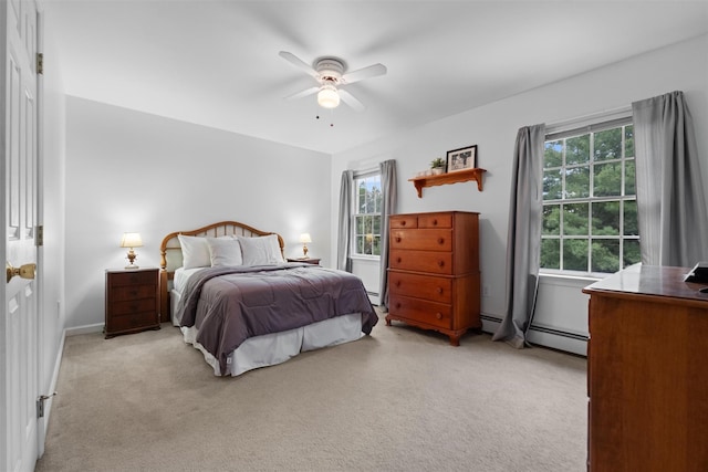 1 Bray Farm Ln, Wappingers Falls, NY 12590 - bedroom with multiple windows, light colored carpet, a ceiling fan, and a baseboard radiator
