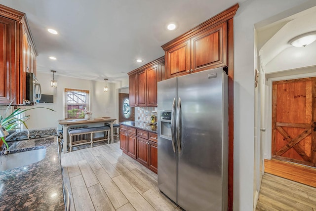 1668 Atherton Ave, Elmont, NY 11003 - kitchen featuring appliances with stainless steel finishes, light wood-type flooring, recessed lighting, backsplash, and dark stone countertops