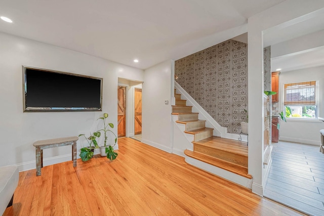 1668 Atherton Ave, Elmont, NY 11003 - unfurnished living room featuring stairway, wood finished floors, and recessed lighting