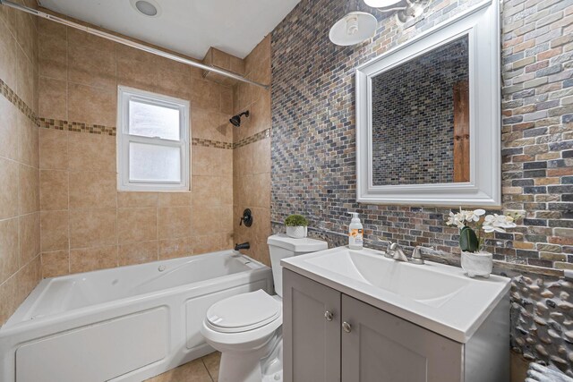 1668 Atherton Ave, Elmont, NY 11003 - full bathroom featuring vanity, toilet, tile patterned flooring,  shower combination, and tile walls