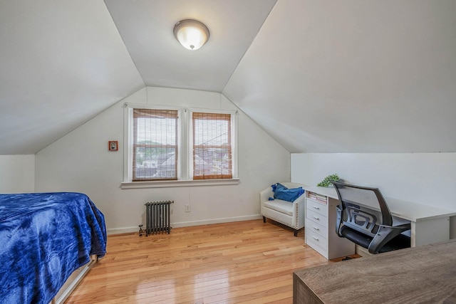 1668 Atherton Ave, Elmont, NY 11003 - bedroom with radiator heating unit, light wood finished floors, lofted ceiling, and baseboards
