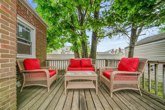 1668 Atherton Ave, Elmont, NY 11003 - wooden terrace featuring an outdoor hangout area