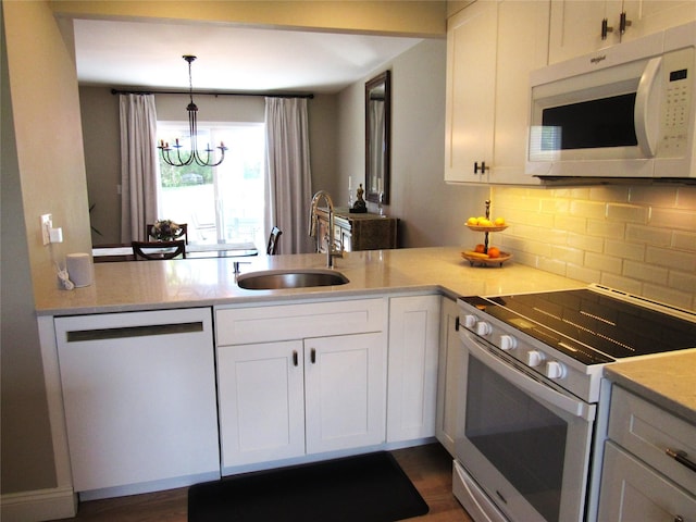 44 Vanderburgh Rd, Poughquag, NY 12570 - kitchen featuring white appliances, a sink, backsplash, a chandelier, and white cabinets