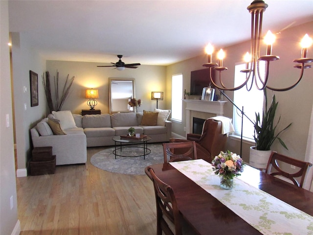 44 Vanderburgh Rd, Poughquag, NY 12570 - dining room featuring wood finished floors, ceiling fan, baseboards, and a glass covered fireplace
