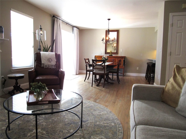 44 Vanderburgh Rd, Poughquag, NY 12570 - living area featuring light wood-style flooring, a chandelier, and baseboards