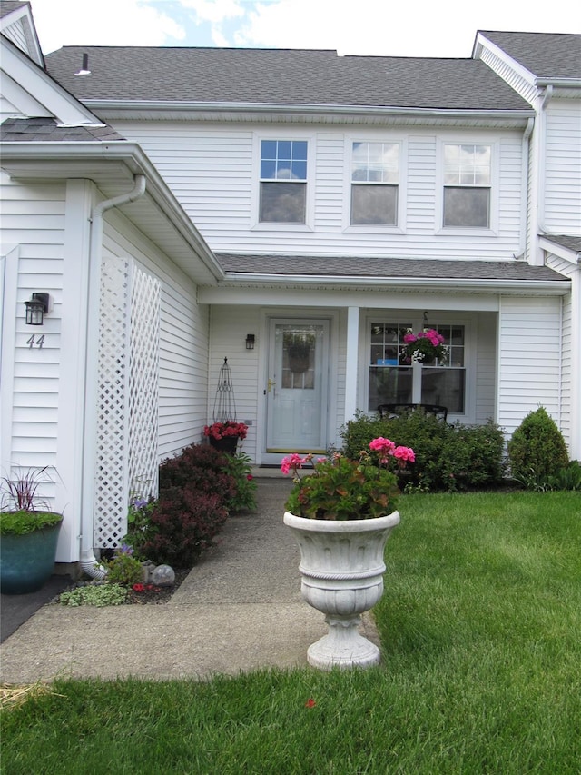 44 Vanderburgh Rd, Poughquag, NY 12570 - doorway to property featuring a lawn, roof with shingles, and covered porch