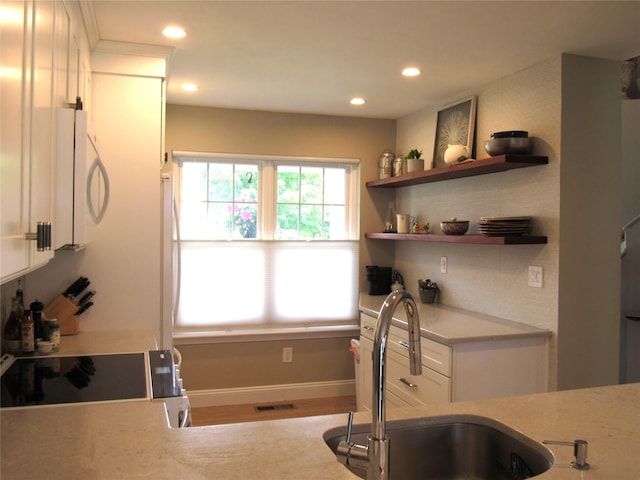 44 Vanderburgh Rd, Poughquag, NY 12570 - kitchen with white microwave, a sink, recessed lighting, white cabinetry, and range