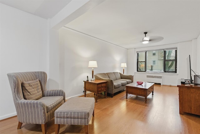 70 Sherman Ave Unit 2G, Yonkers, NY 10705 - living area featuring radiator heating unit, light wood-style floors, and a ceiling fan