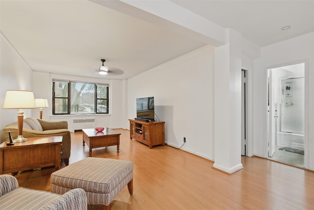 70 Sherman Ave Unit 2G, Yonkers, NY 10705 - living room featuring radiator, light wood-style flooring, and a ceiling fan