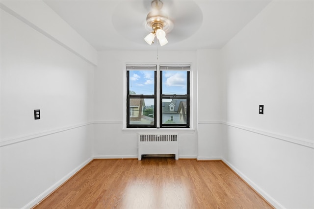 70 Sherman Ave Unit 2G, Yonkers, NY 10705 - spare room featuring radiator heating unit, light wood-style floors, ceiling fan, and baseboards