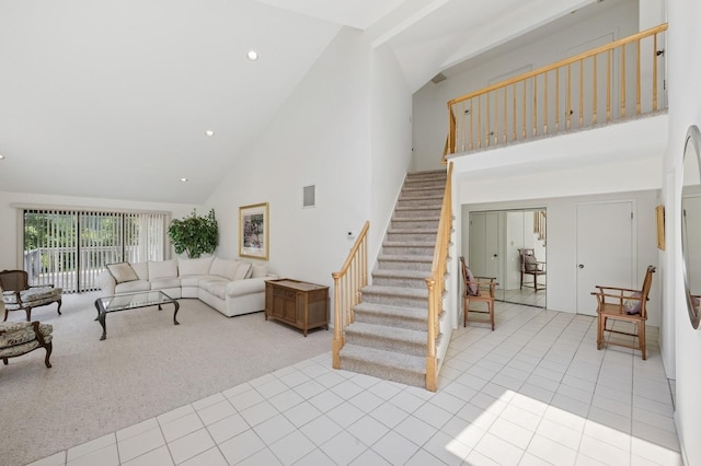 15 Augusta Ln, Manhasset, NY 11030 - living area with high vaulted ceiling, stairs, light colored carpet, light tile patterned flooring, and recessed lighting