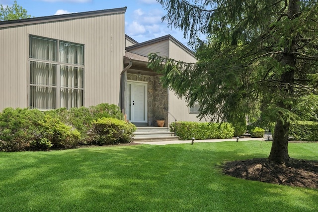 15 Augusta Ln, Manhasset, NY 11030 - view of front facade with a front lawn and stone siding