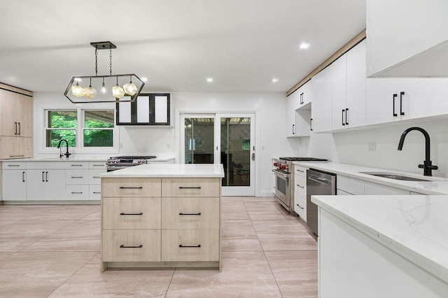 10 Karow Ct, Monsey, NY 10952 - kitchen featuring stainless steel appliances, light brown cabinetry, a sink, light stone countertops, and a kitchen island