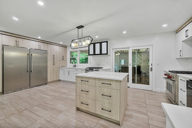 10 Karow Ct, Monsey, NY 10952 - kitchen featuring premium appliances, light brown cabinets, light countertops, a kitchen island, and recessed lighting