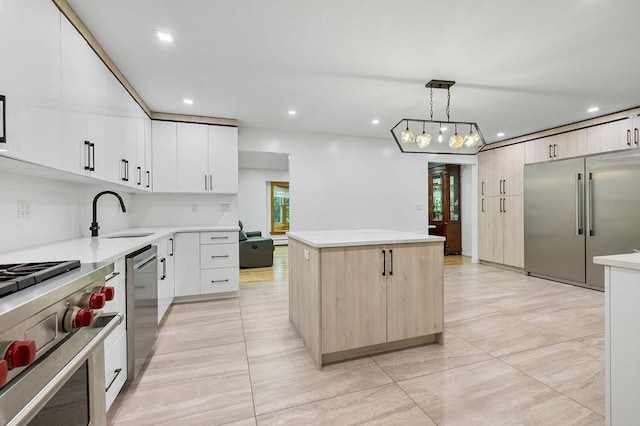 10 Karow Ct, Monsey, NY 10952 - kitchen featuring high quality appliances, a sink, a center island, light tile patterned floors, and light countertops