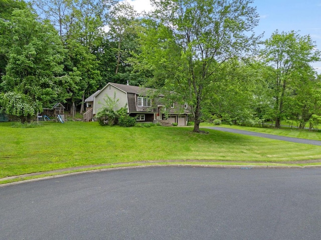 10 Karow Ct, Monsey, NY 10952 - view of front of property with asphalt driveway, a front lawn, and a garage
