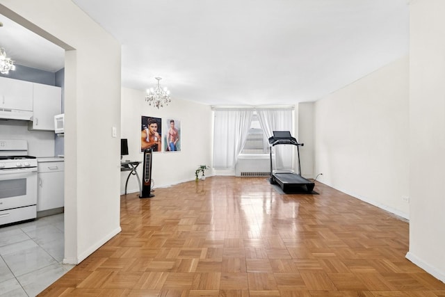 125-10 Queens Blvd Unit 14-25, Kew Gardens, NY 11415 - exercise area featuring a chandelier and baseboards