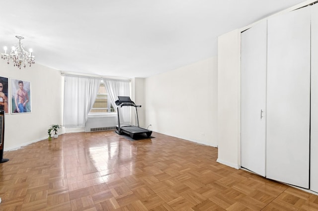 125-10 Queens Blvd Unit 14-25, Kew Gardens, NY 11415 - workout area featuring a chandelier and baseboards