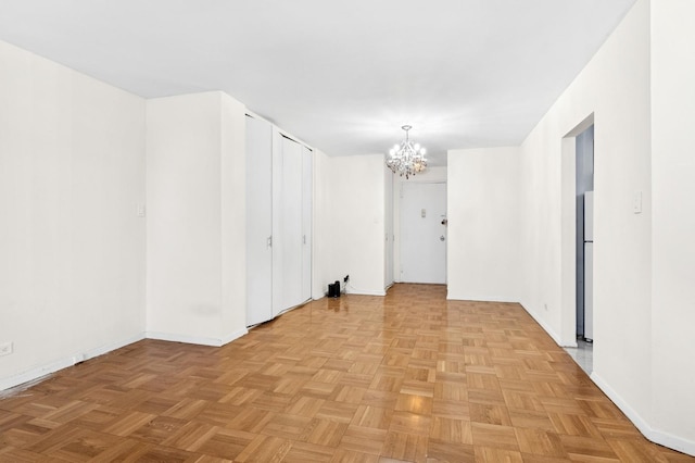 125-10 Queens Blvd Unit 14-25, Kew Gardens, NY 11415 - unfurnished room featuring a chandelier and baseboards