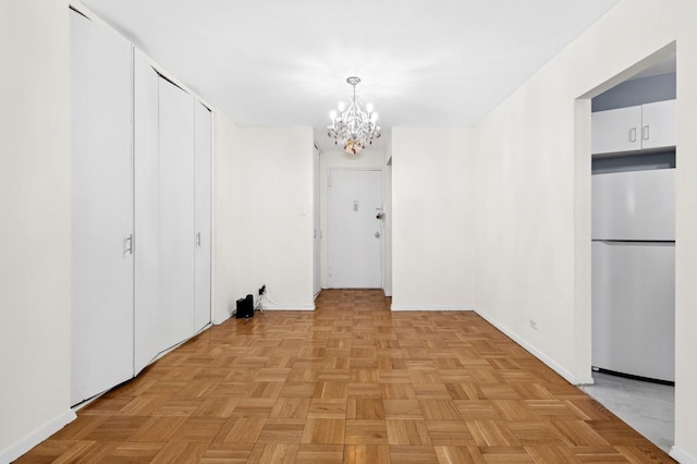 125-10 Queens Blvd Unit 14-25, Kew Gardens, NY 11415 - hall with a chandelier and baseboards