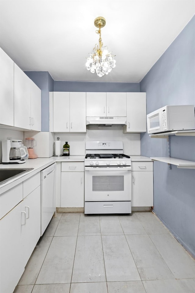 125-10 Queens Blvd Unit 14-25, Kew Gardens, NY 11415 - kitchen with white appliances, under cabinet range hood, light countertops, and white cabinetry