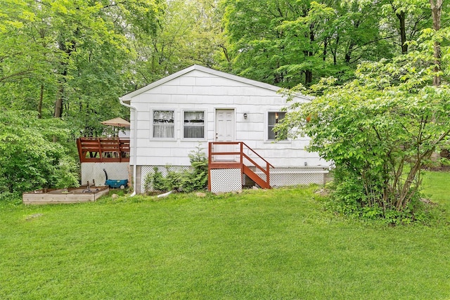 3300 Baker Unit 11, Mohegan Lake, NY 10547 - rear view of property featuring a yard and a wooden deck