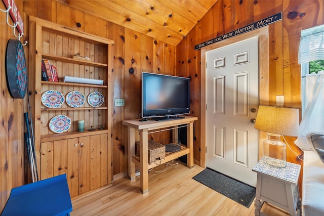 3300 Baker Unit 11, Mohegan Lake, NY 10547 - living room with lofted ceiling, wood finished floors, and wooden walls