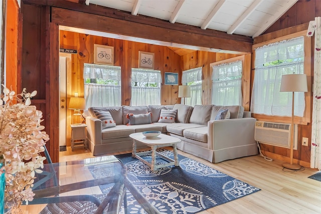 3300 Baker Unit 11, Mohegan Lake, NY 10547 - living room featuring wooden walls, wood finished floors, and a wall mounted air conditioner