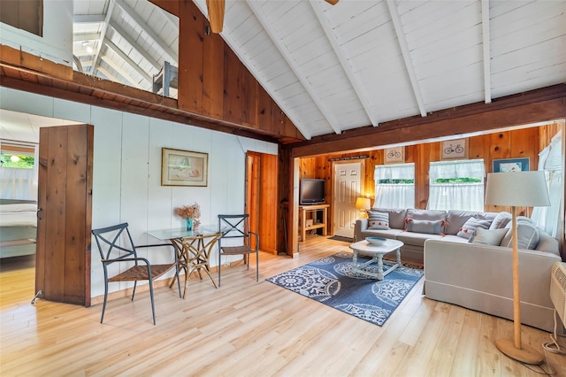 3300 Baker Unit 11, Mohegan Lake, NY 10547 - living room featuring high vaulted ceiling, healthy amount of natural light, wood finished floors, beam ceiling, and wood walls