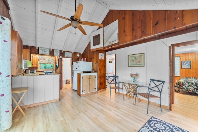 3300 Baker Unit 11, Mohegan Lake, NY 10547 - kitchen with freestanding refrigerator, light wood-style floors, wood walls, and a ceiling fan