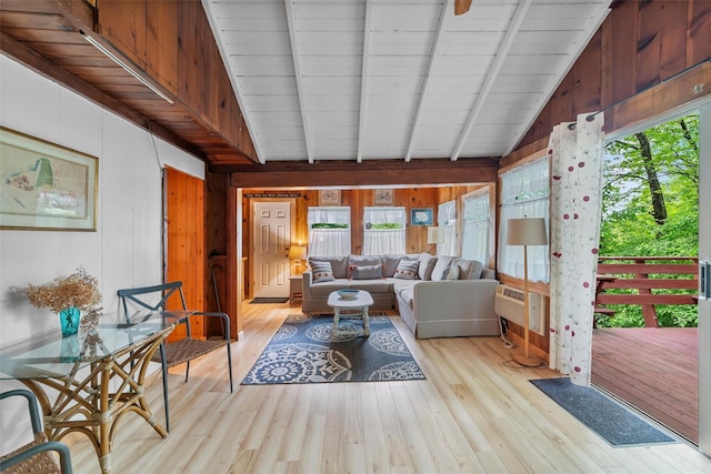 3300 Baker Unit 11, Mohegan Lake, NY 10547 - living area with wood walls, plenty of natural light, light wood-style floors, and beamed ceiling
