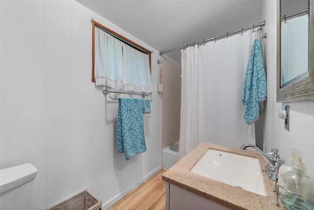 3300 Baker Unit 11, Mohegan Lake, NY 10547 - bathroom with toilet, vanity, wood finished floors, and shower / tub combo