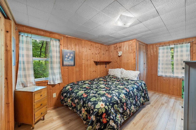 3300 Baker Unit 11, Mohegan Lake, NY 10547 - bedroom with light wood-style floors and wood walls