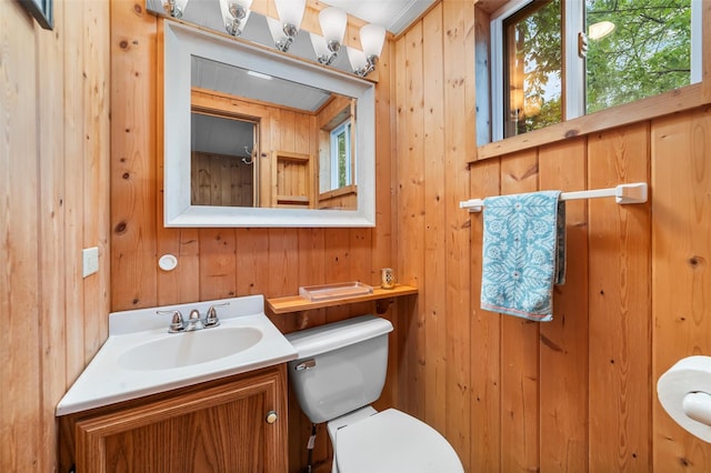 3300 Baker Unit 11, Mohegan Lake, NY 10547 - half bath featuring toilet, vanity, and wooden walls