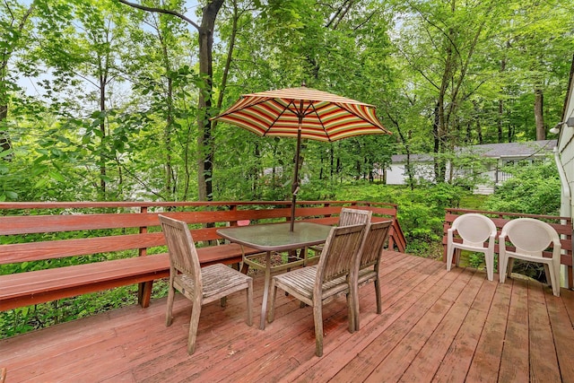 3300 Baker Unit 11, Mohegan Lake, NY 10547 - wooden deck with outdoor dining space and view of wooded area