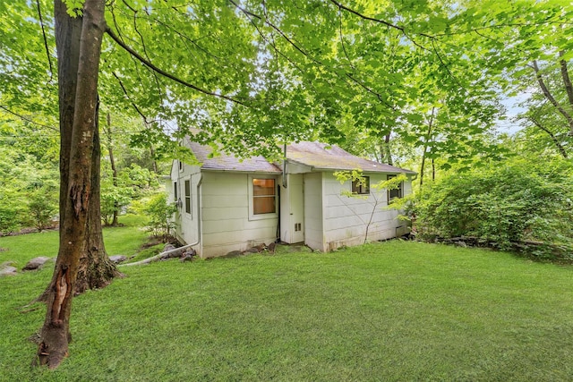3300 Baker Unit 11, Mohegan Lake, NY 10547 - back of property with roof with shingles and a yard