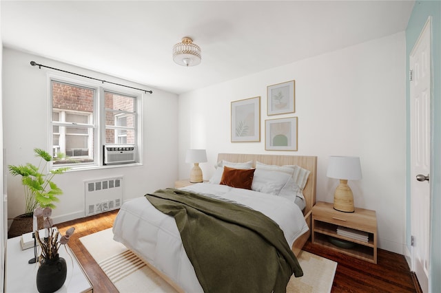 180 Van Cortlandt Park S Unit 4C, Bronx, NY 10463 - bedroom with radiator, wood finished floors, baseboards, and cooling unit